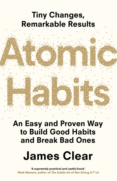 Book cover of 'Atomic Habits' by James Clear with gold text on a white background